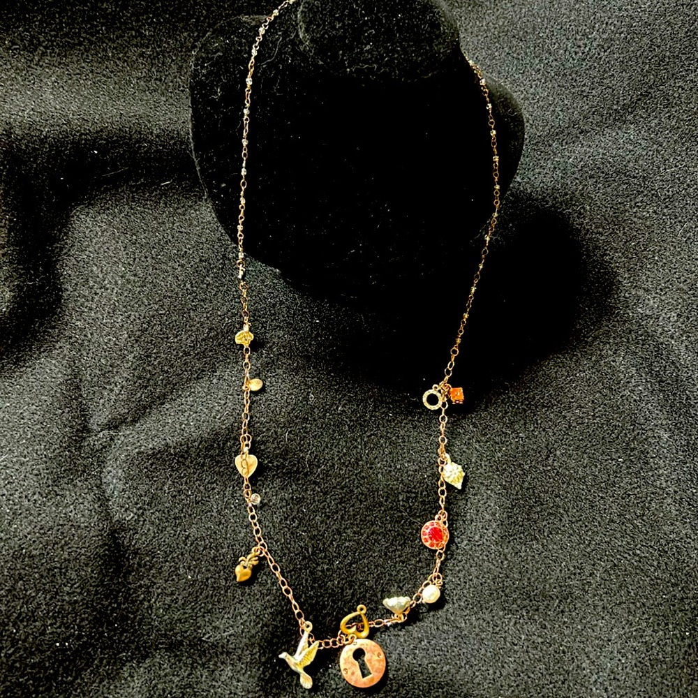 Express copper tone necklace with charms